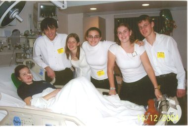 teenagers with chronic illness | ANCA Vasculitis News | A 2004 photo shows Allison, then a teenager, lying in a hospital bed and surrounding by teenage friends from church.