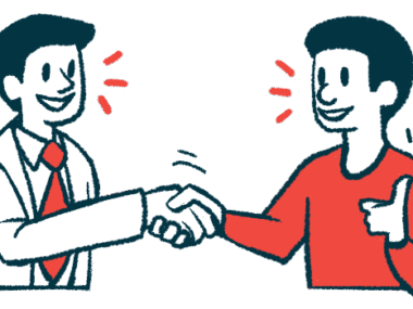 A patient gives a thumbs-up while shaking hands with a clinician.